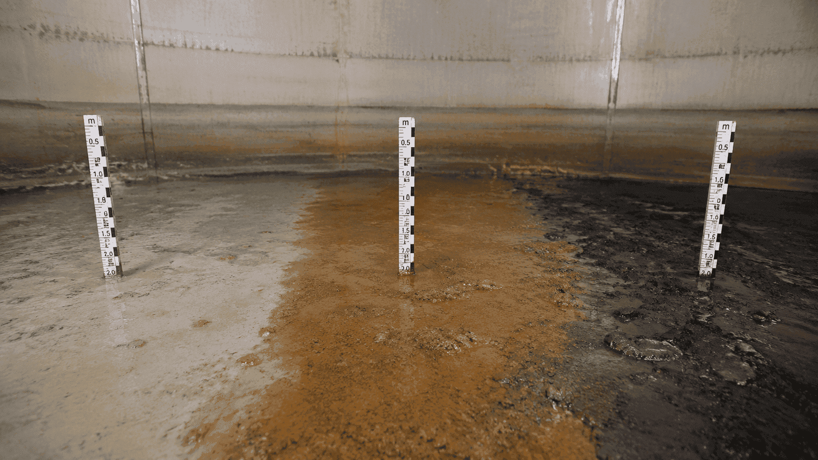 Side-by-side comparison of silicate silt, iron precipitate, and black biofilm sludge sediment types